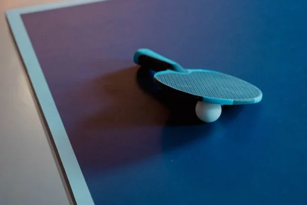 table tennis paddle and ball closeup